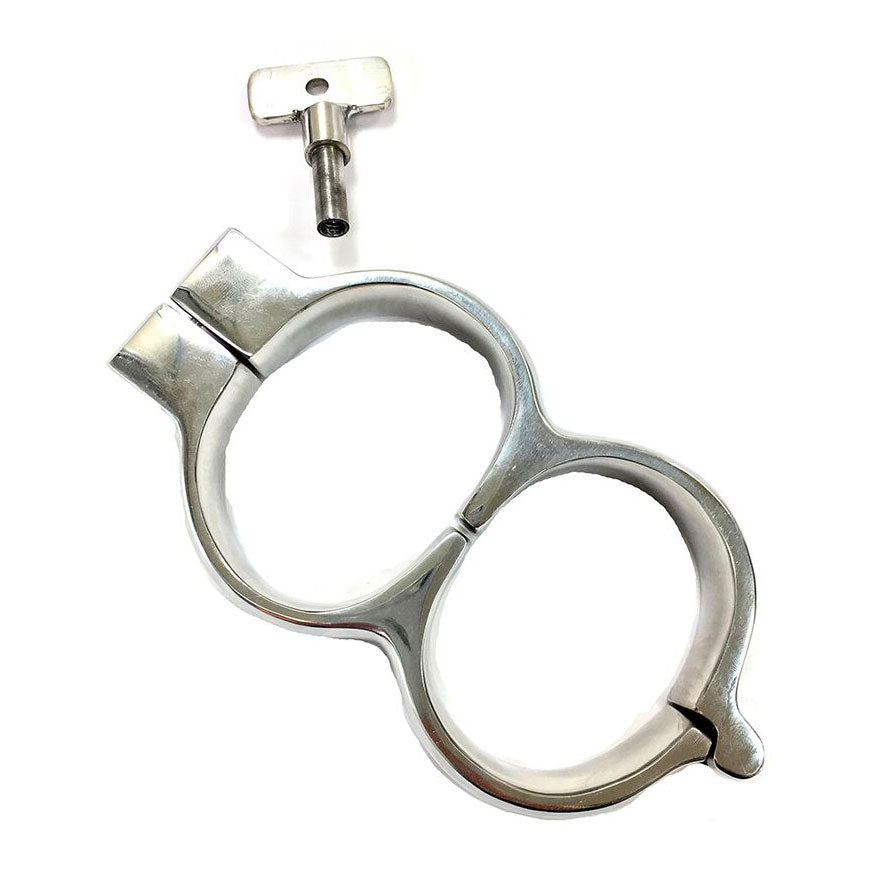 rouge stainless steel wrist restraints with a lockable mechanism, shiny finish, for play.