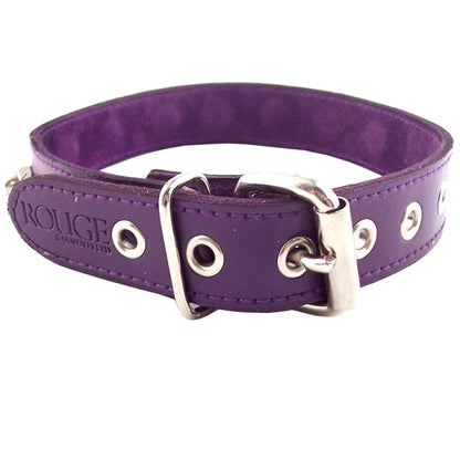 A purple fabric dog collar with a metal nut-shaped embellishment, designed by rouge garments.