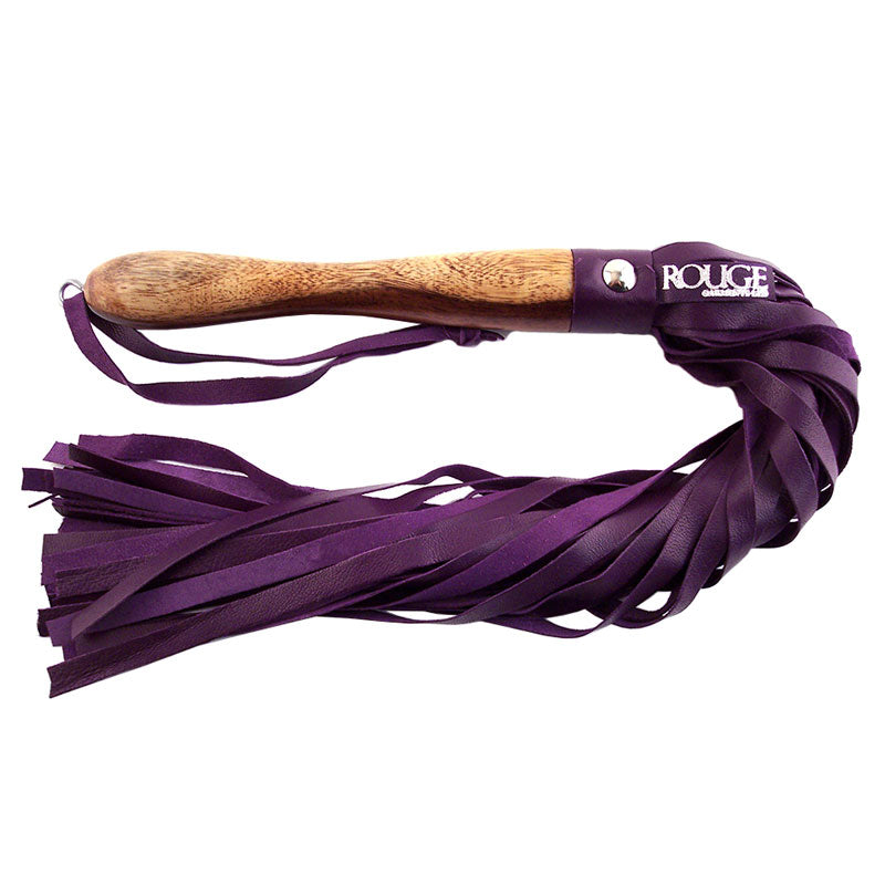 Rouge Garments flogger with a wooden handle and purple leather lashes. For play.