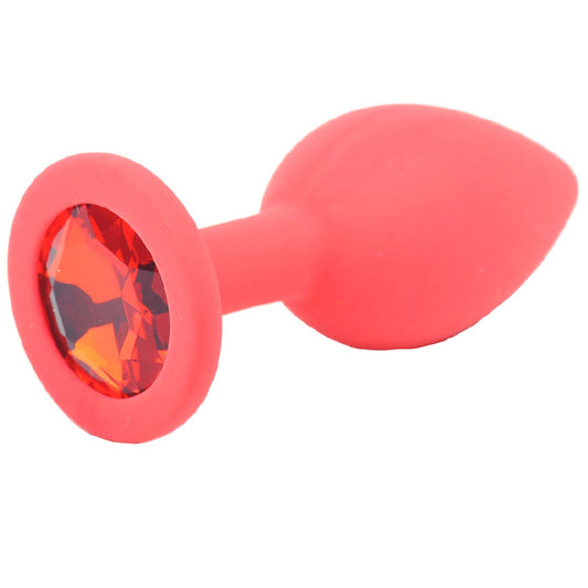 A small, red silicone butt plug with a jewelled base for added flair.