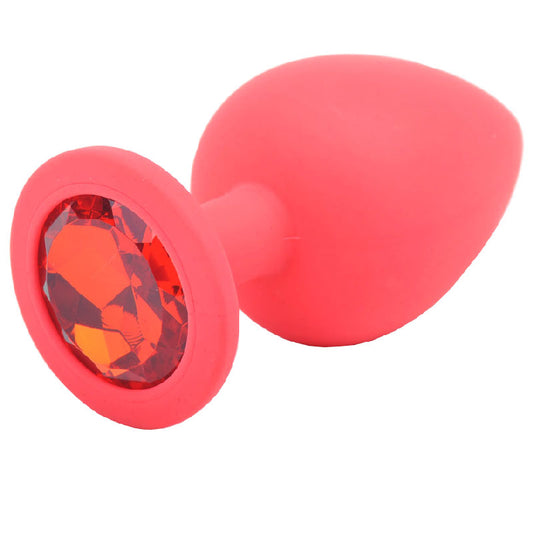 Large red silicone butt plug from various toy brands, with jewelled detailing.