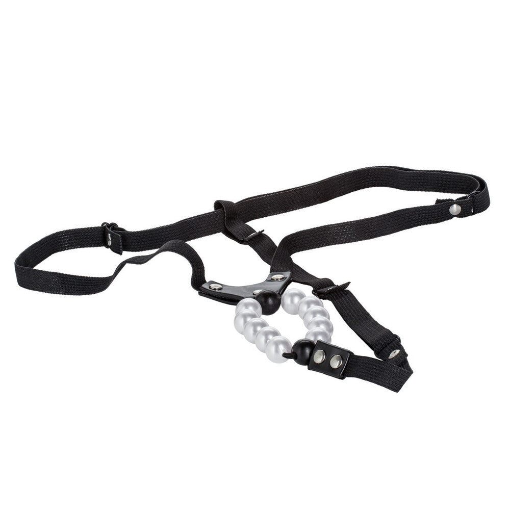 A red, stretchy thong with a vibrating clitoral stimulator featuring pleasure pearls.