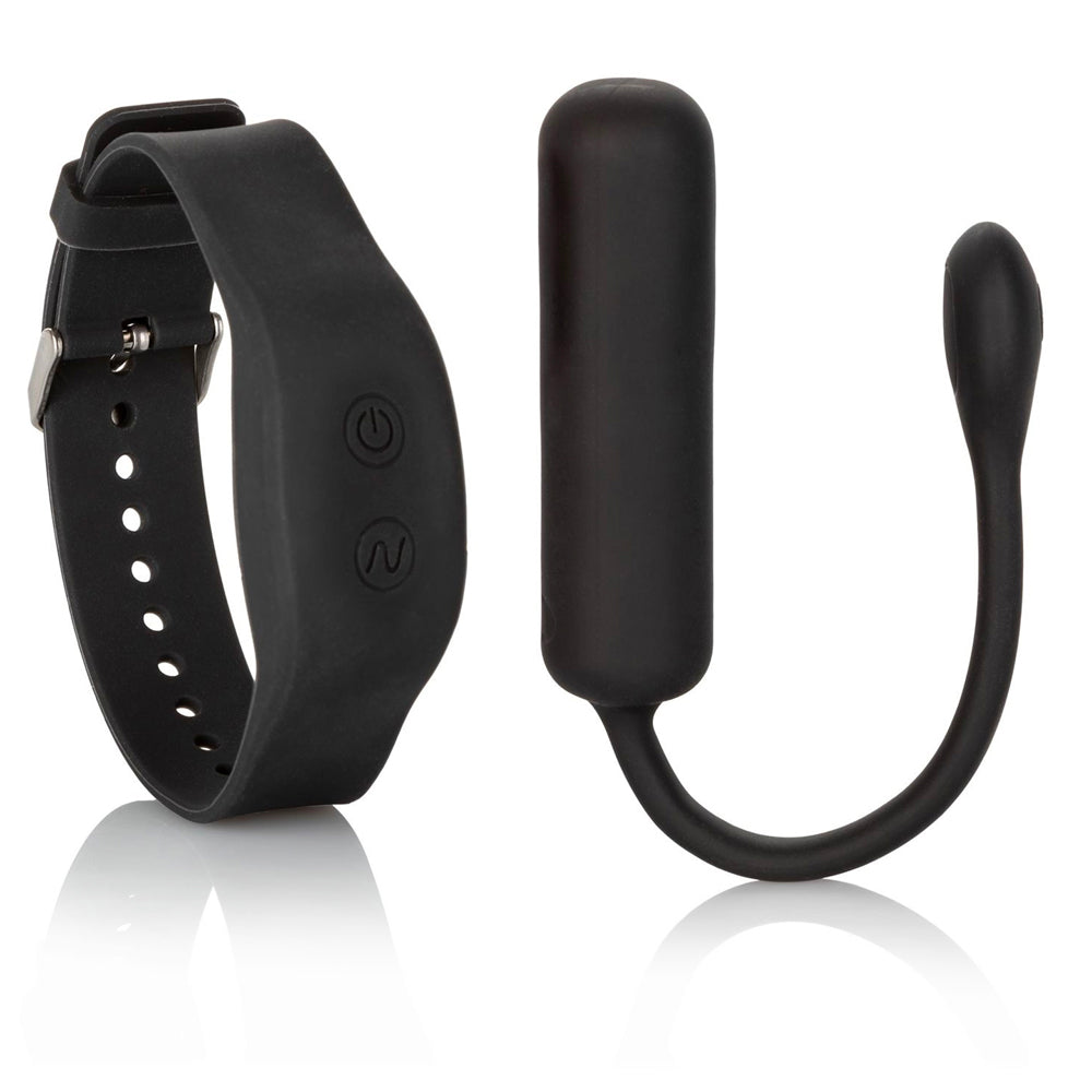 Petite bullet vibrator in a pale colour with a rechargeable wristband remote, shown close-up.