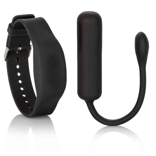 Petite bullet vibrator in a pale colour with a rechargeable wristband remote, shown close-up.