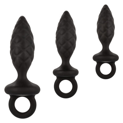 Three different sized silicone anal probes, part of a butt plug kit, silver finish.