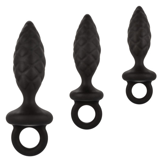 Three different sized silicone anal probes, part of a butt plug kit, silver finish.