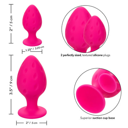 Pair of pink, soft silicone butt plugs from California Exotic, in two sizes.