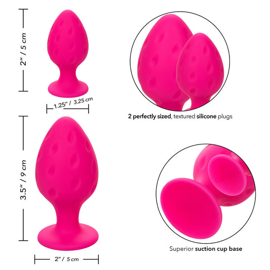 Pair of pink, soft silicone butt plugs from California Exotic, in two sizes.