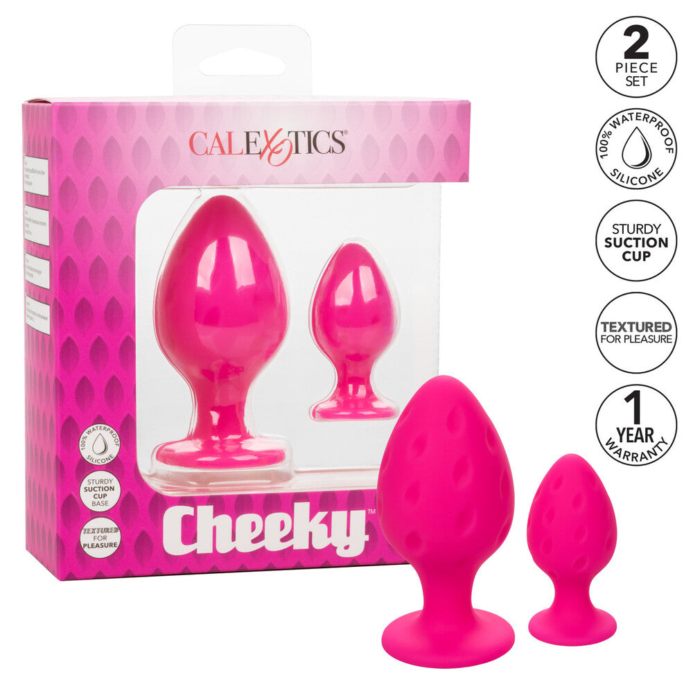 A pair of pink, smooth silicone butt plugs, one slightly larger than the other.