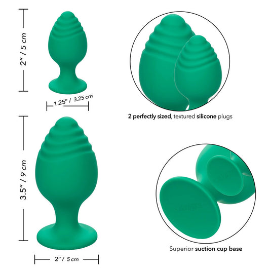 Two green, silicone butt plugs with a flared base, perfect for anal play