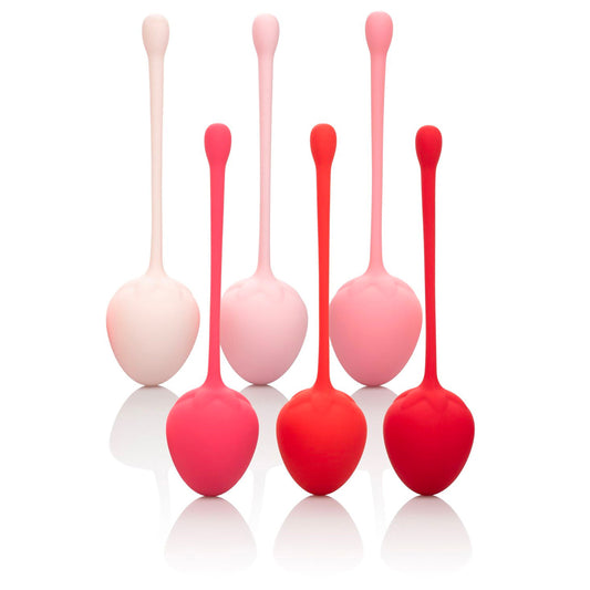Strawberry-coloured kegel training set for pelvic floor exercises, made from smooth, body-safe material.