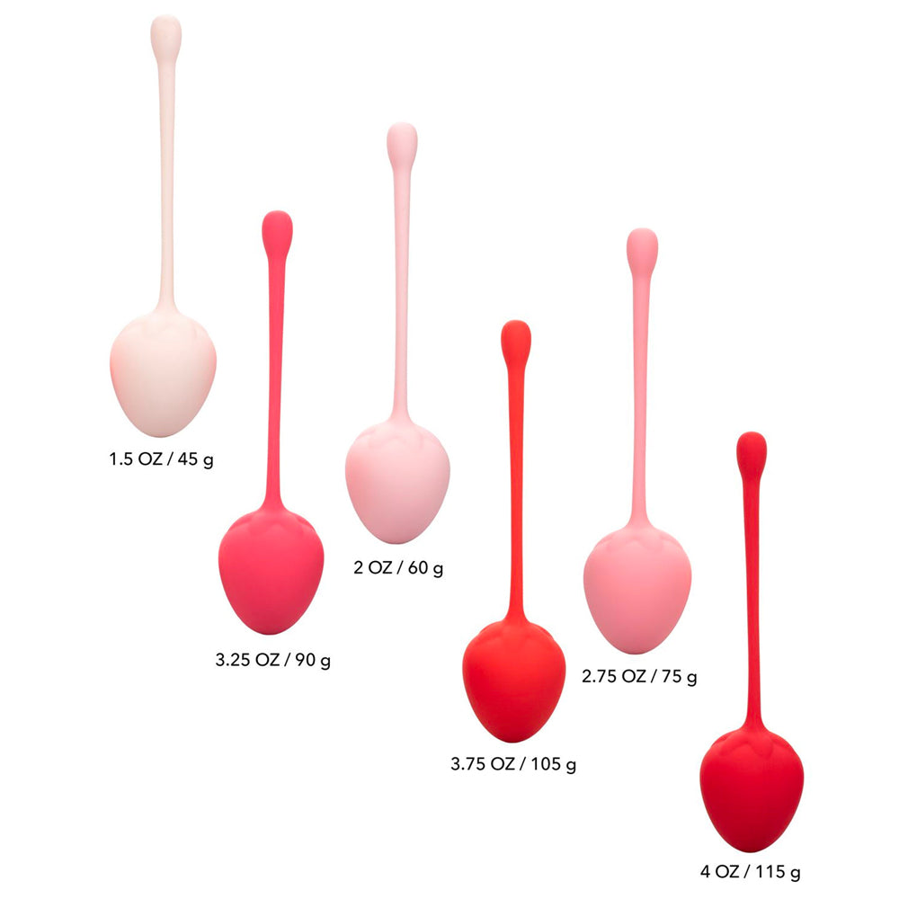 Strawberry coloured kegel training set for pelvic floor exercises, presented in a cute manner.