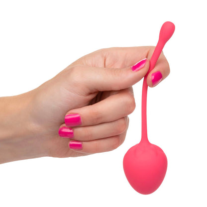 Strawberry-coloured kegel training set for pelvic floor exercises, made by California Exotic.