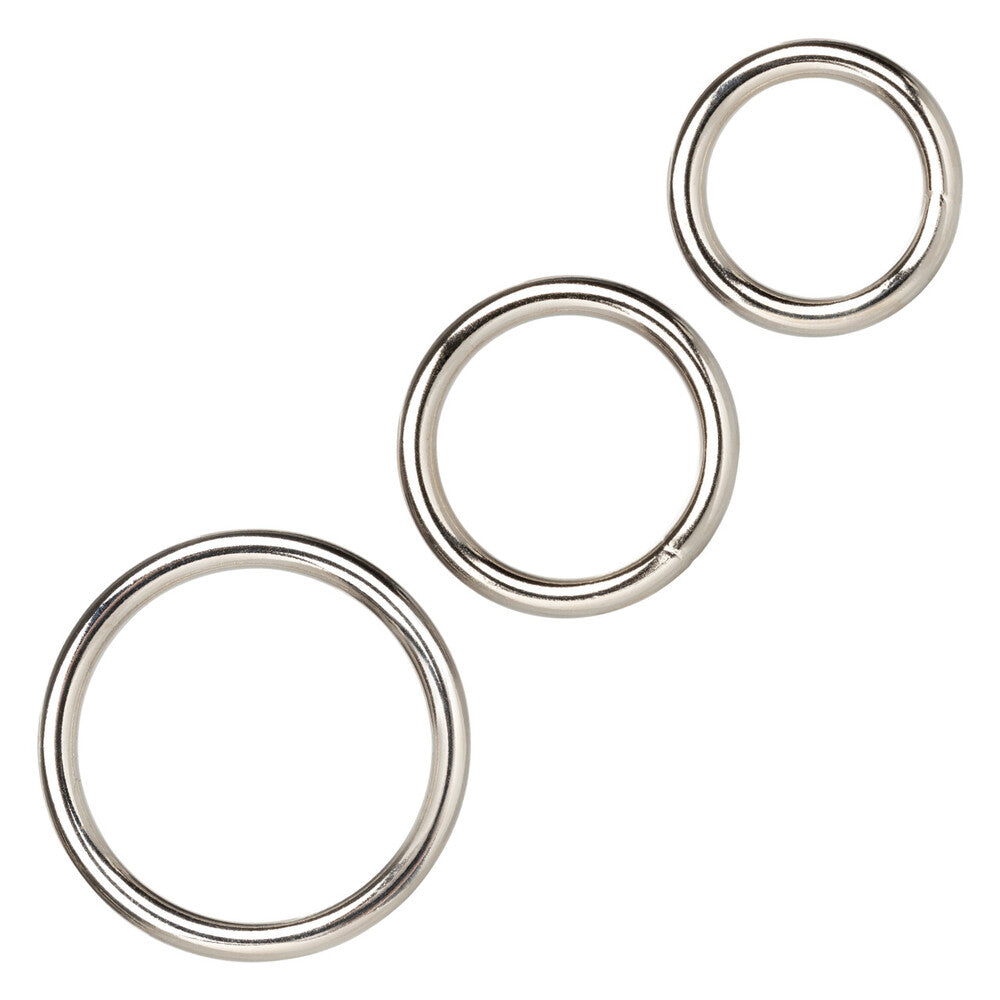 Three silver-tone love rings set, polished metal finish, perfect for stacking.