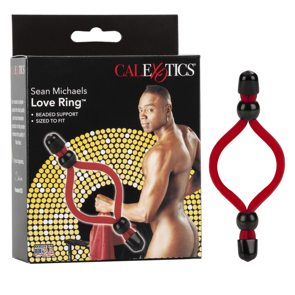 Close-up of a silver-tone 'sean michaels love ring', a metallic marital aid for adults.
