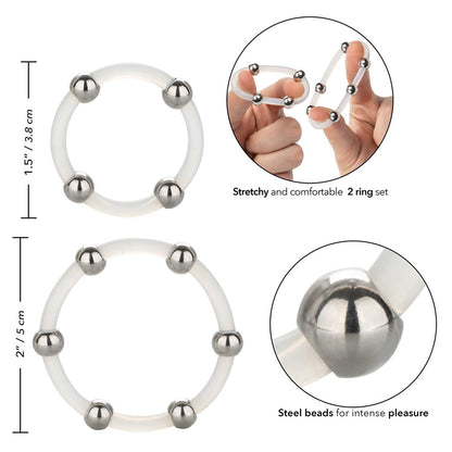 Close-up of a set of smooth, durable silicone rings in silver and gunmetal grey with subtle steel beads.