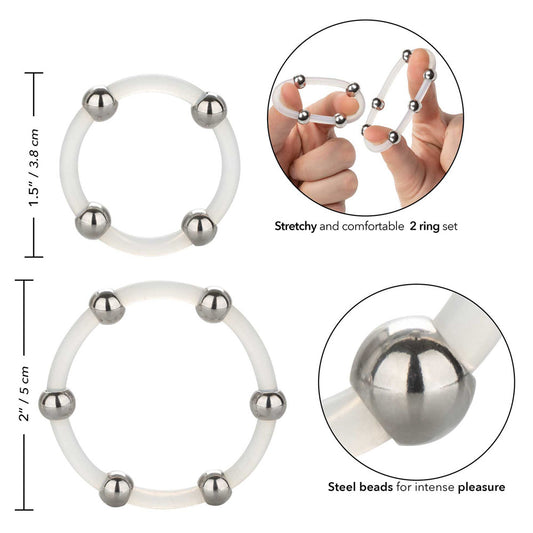 Close-up of a set of smooth, durable silicone rings in silver and gunmetal grey with subtle steel beads.