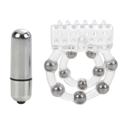 Close-up on a clear silicone cock ring with ten textured beads, used for enhanced pleasure.