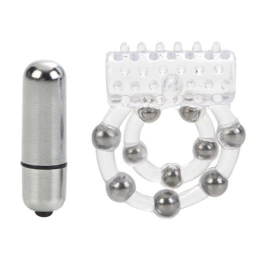 Close-up on a clear silicone cock ring with ten textured beads, used for enhanced pleasure.