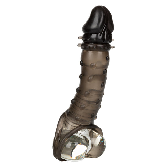 Close-up of a flesh-toned ultimate stud extender from California Exotic, a penis sleeve.
