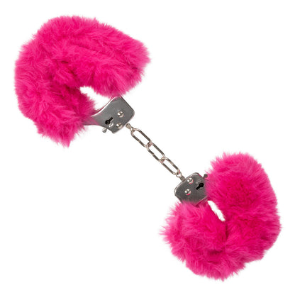 Close-up of pink, ultra fluffy furry cuffs, a novelty accessory. Silky smooth material.