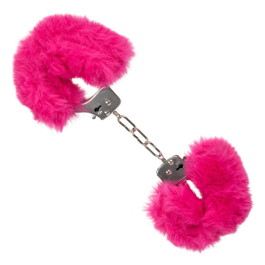 Close-up of pink, ultra fluffy furry cuffs, a novelty accessory. Silky smooth material.