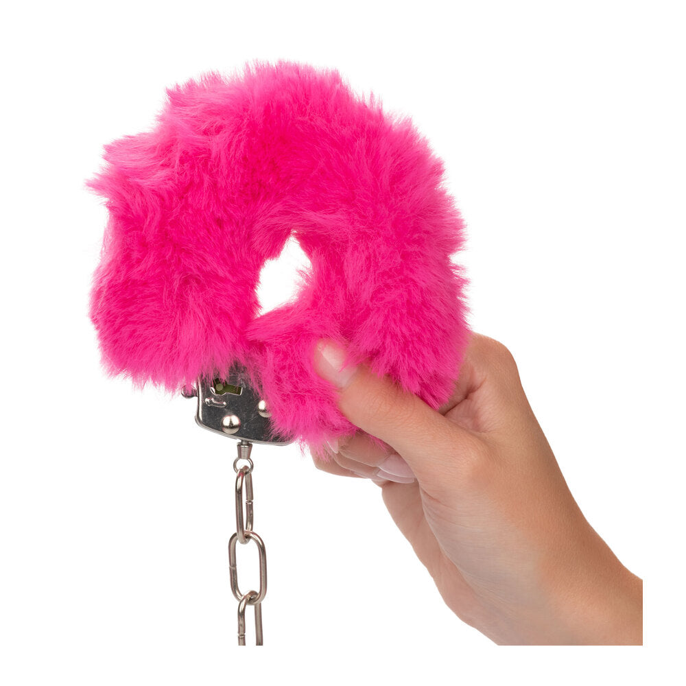 Ultra fluffy pink furry handcuffs, a playful and comfortable bedroom accessory for restraint play.