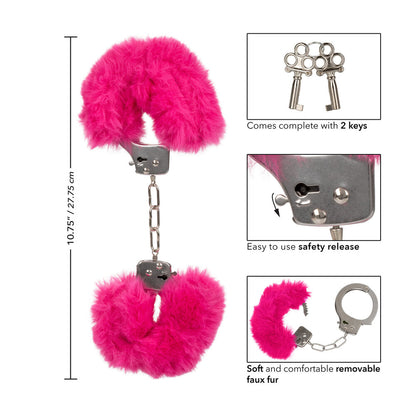 Close-up of california exotic ultra fluffy furry handcuffs in pink, a playful bedroom accessory.