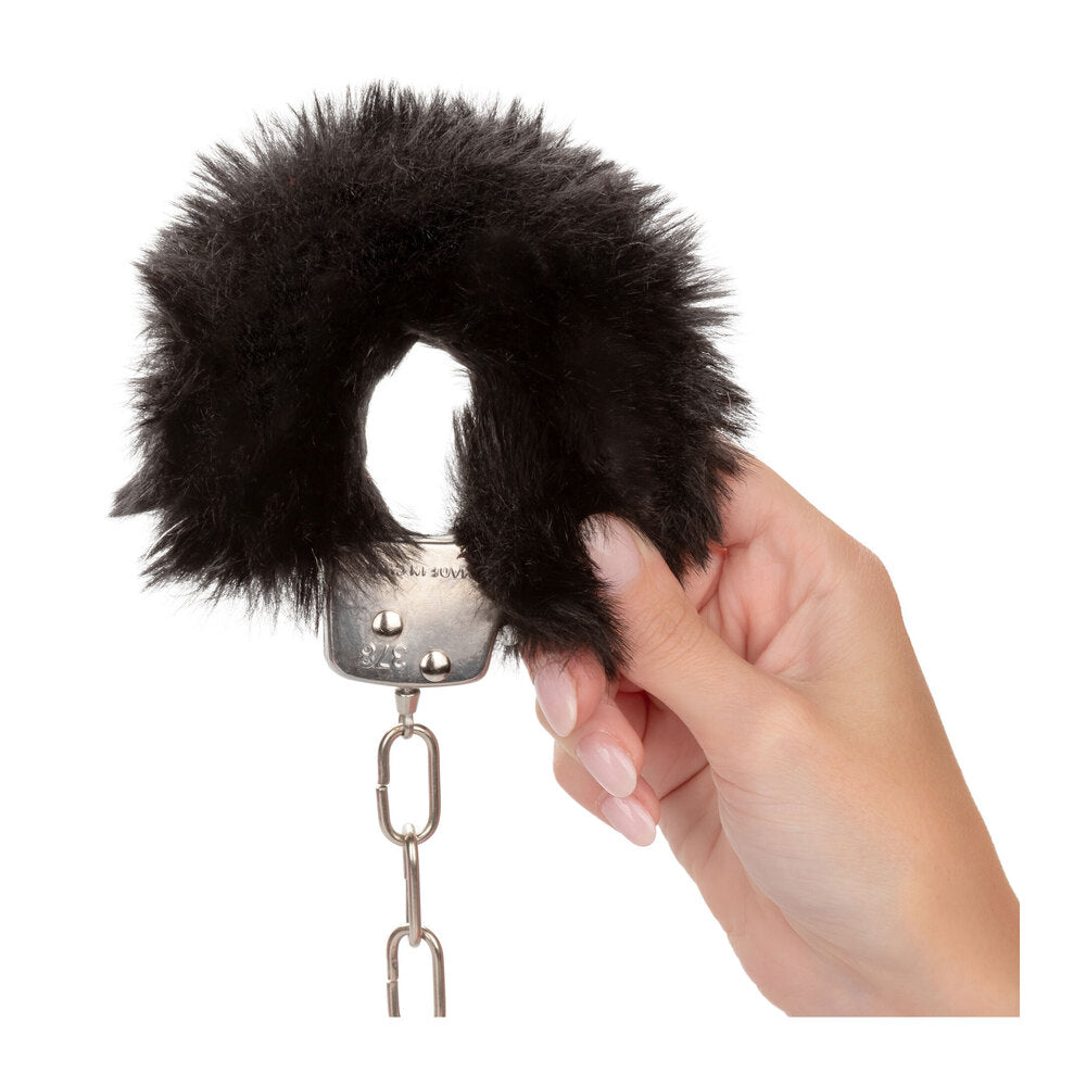 ultra fluffy black furry handcuffs from california exotic, perfect for playful nights in.