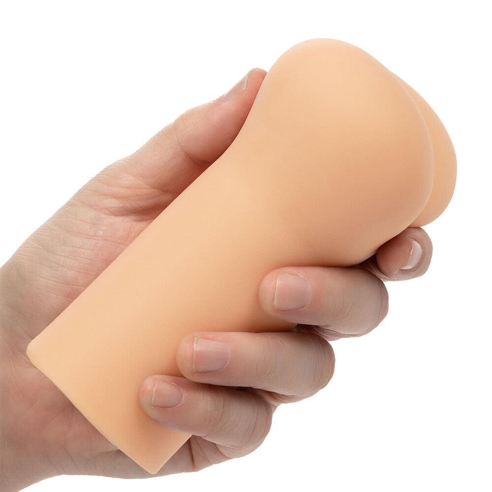 Flesh pink anus masturbator by california exotic, realistically textured for intimate play.