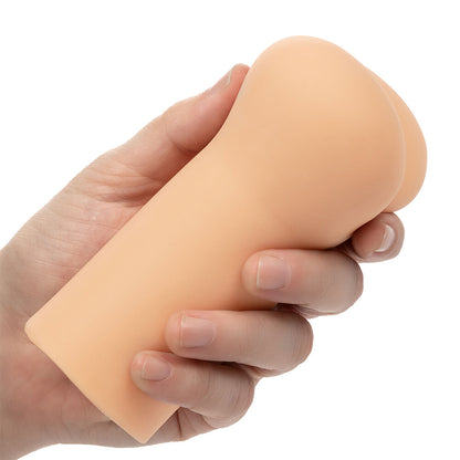 Flesh pink anus masturbator by california exotic, realistically textured for intimate play.