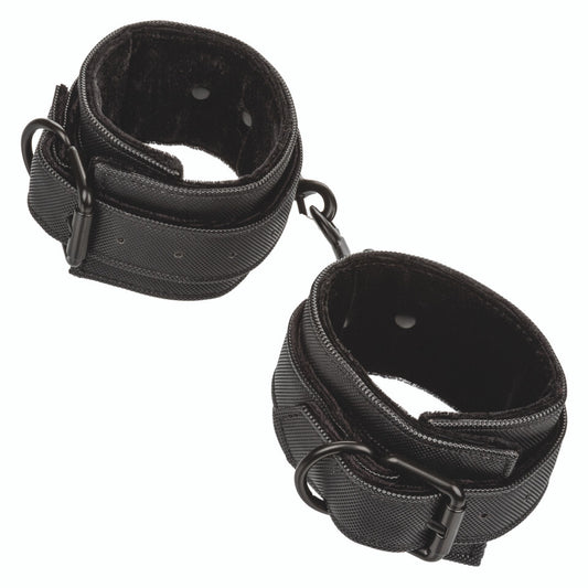 California Exotic Boundless ankle cuffs, black faux leather restraints for playful bondage sessions.