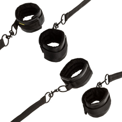 California Exotic Boundless bed restraints, adjustable black nylon straps for bedroom fun.