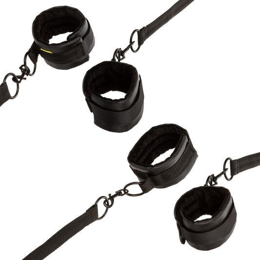 California Exotic Boundless bed restraints, adjustable black nylon straps for bedroom fun.