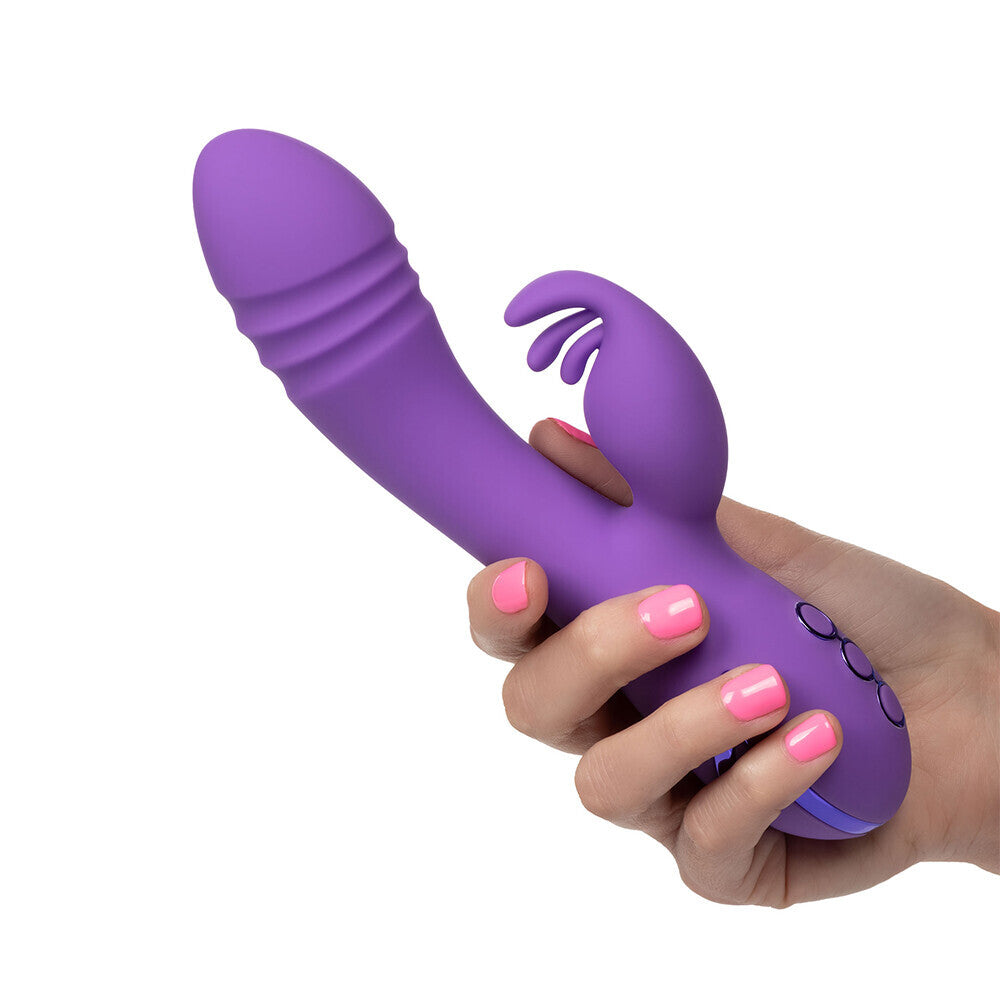 Purple and white vibrator with clit stimulator attachment, for pleasure and exploration.