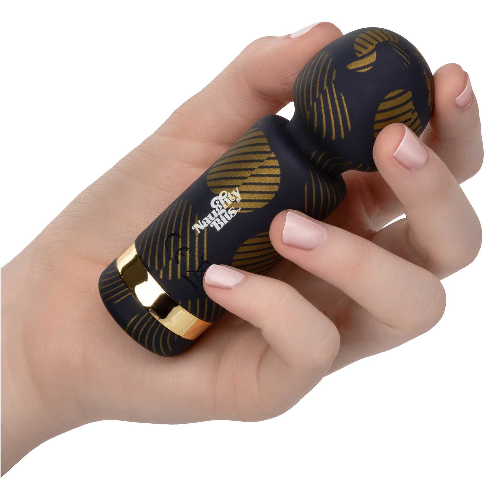 Close-up of a small, sparkly purple wand massager with a light-up clitoral attachment.