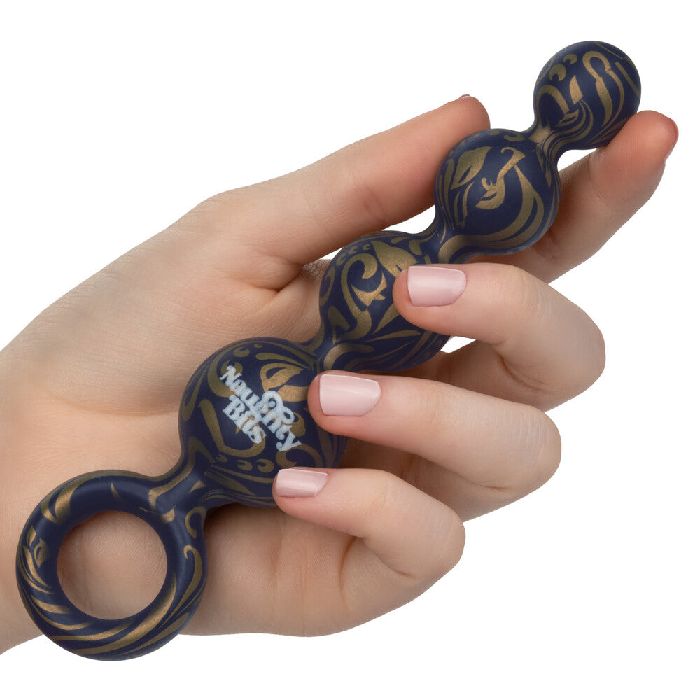 Close-up of naughty bits butt balls: silicone anal beads with a smooth finish.