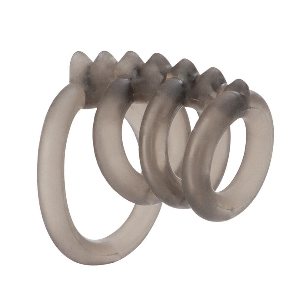 Close-up of a trio of smooth, metallic-looking love rings, possibly silver coloured.