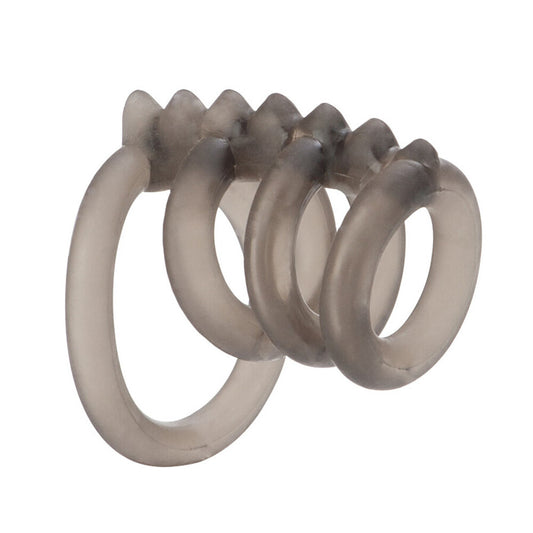 Close-up of a trio of smooth, metallic-looking love rings, possibly silver coloured.