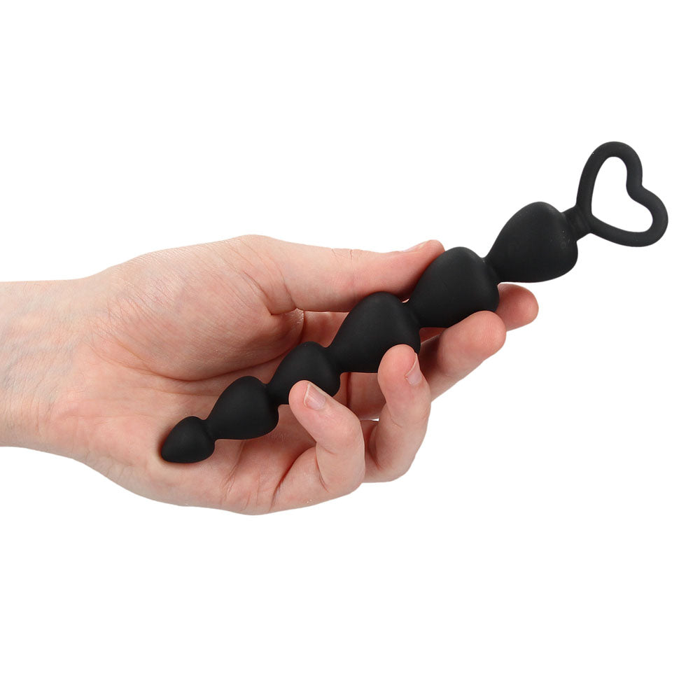 Black silicone anal beads from Shots Toys, a string of graduated pleasure beads.