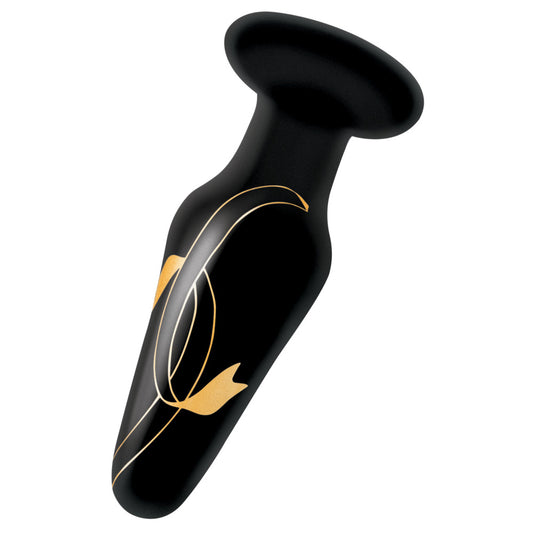 Close-up of a shimmering, smooth four-inch glass butt plug from secret kisses.