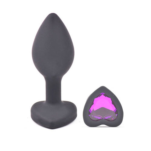 Small black butt plug with heart shaped diamond base, a sleek and playful toy.