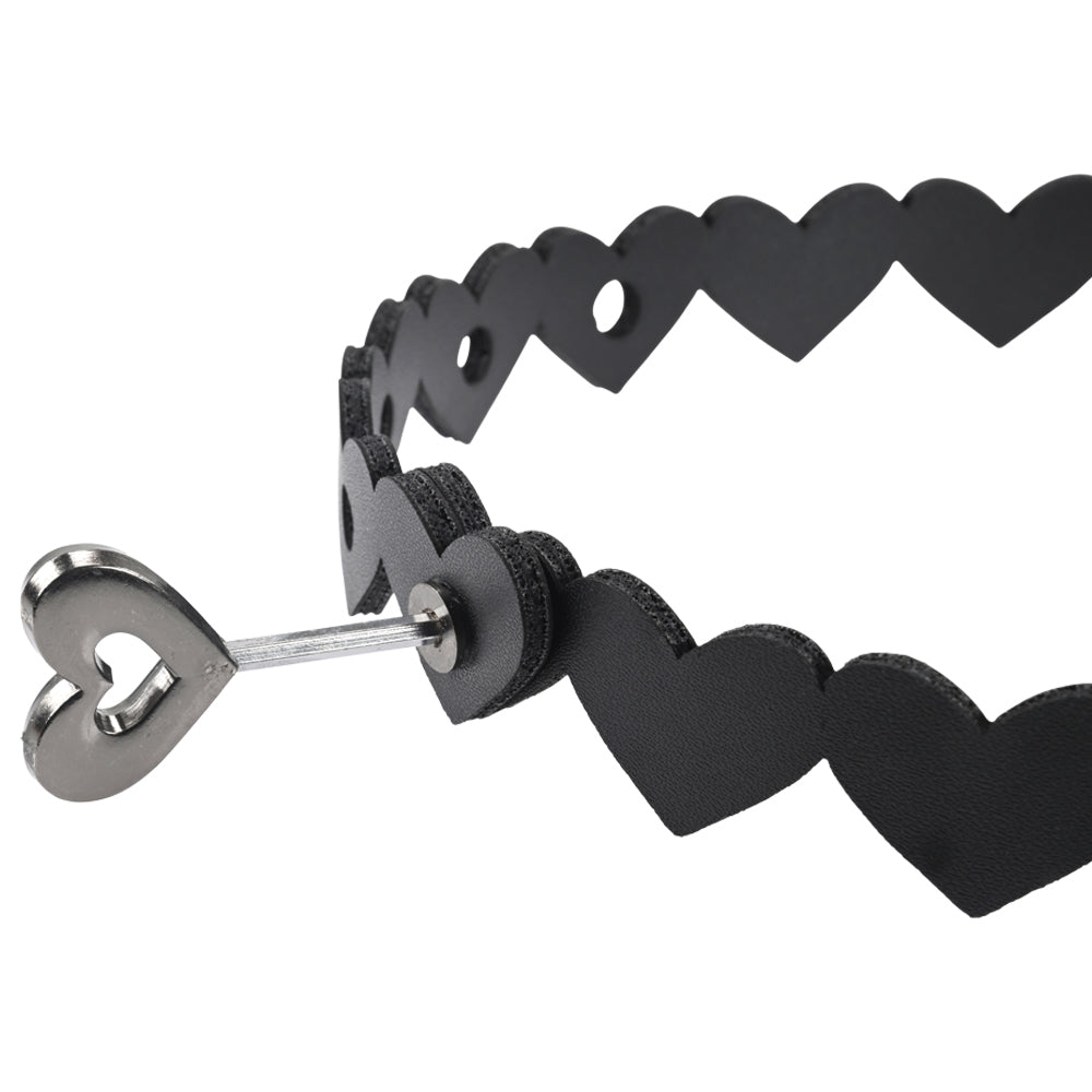 Sportsheets heart-shaped collar, red faux leather with metal o-ring, a playful accessory.