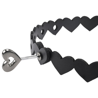 Sportsheets heart-shaped collar, red faux leather with metal o-ring, a playful accessory.