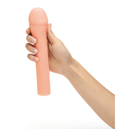 size up penis extender, a flesh-toned sleeve designed to add three inches, close-up view.