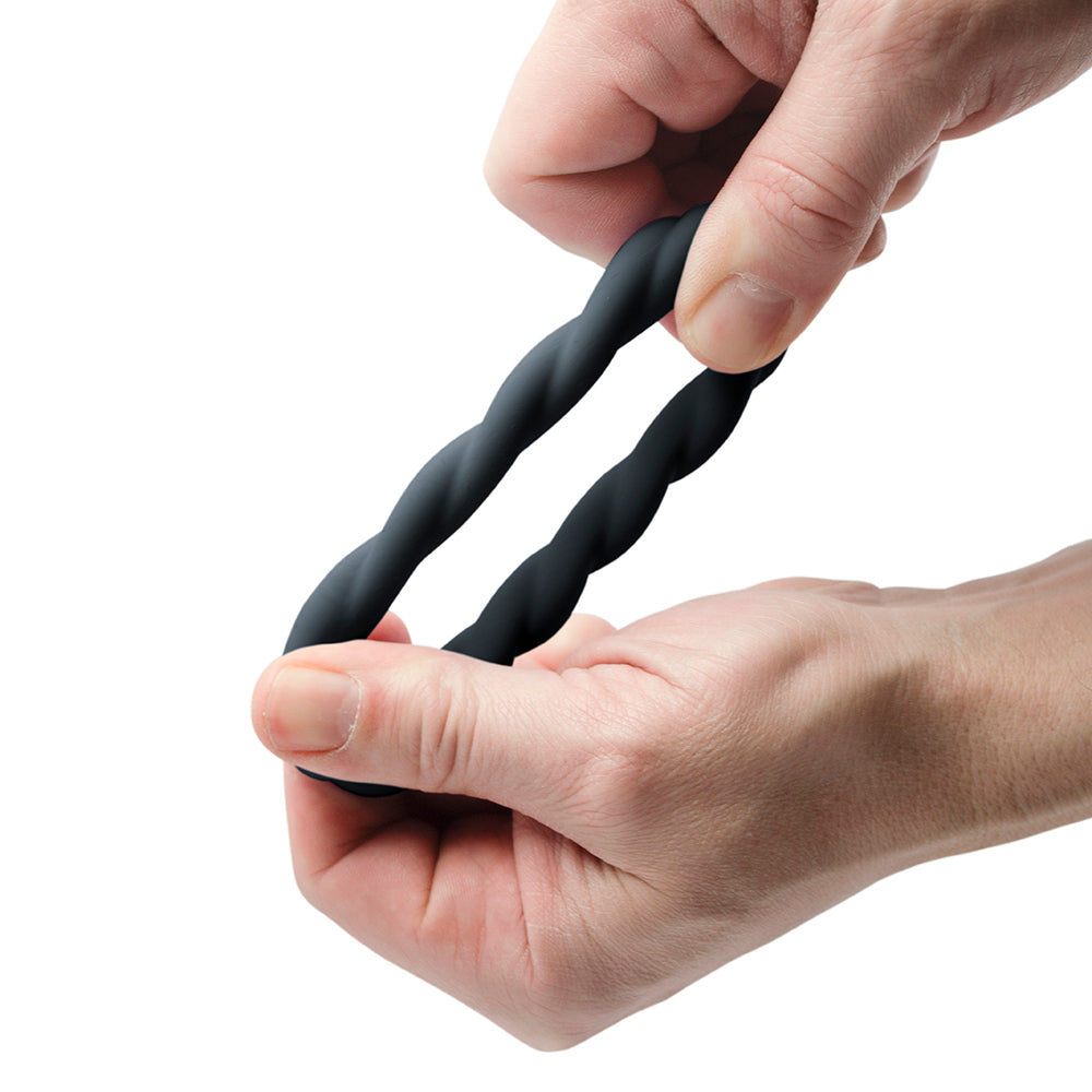 Black, flexible love ring from Rocks Off with a textured, twisted design for enhanced pleasure.