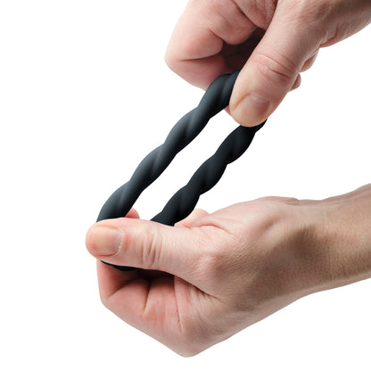 Black, flexible love ring from Rocks Off with a textured, twisted design for enhanced pleasure.