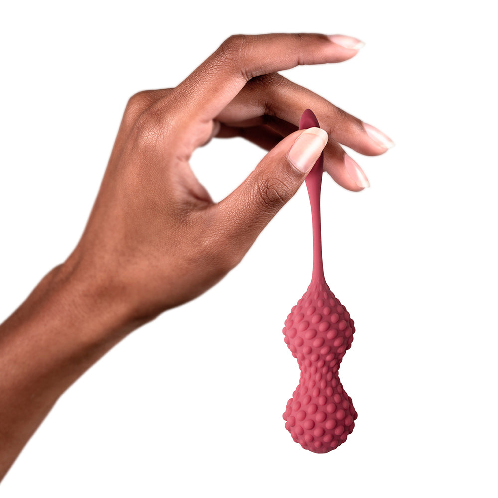 Rocks Off Unite kegel exercise set in pink silicone for pelvic floor fitness.