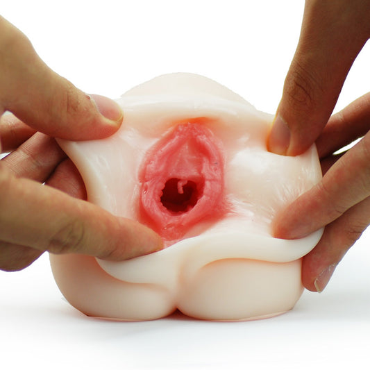 Utensil Race masturbator, flesh-toned silicone with textured interior for hands-free male pleasure.