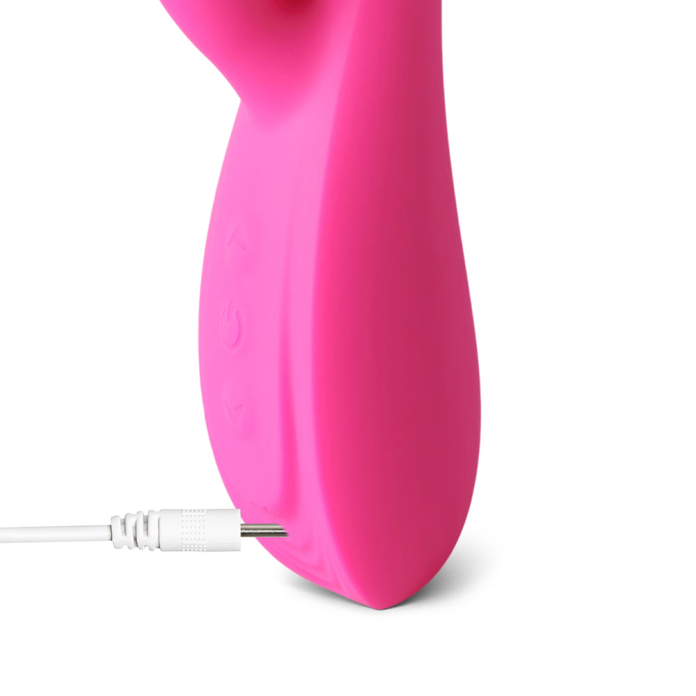 Silicone bunny vibrator, a pink adult toy featuring rabbit ears and a smooth finish.